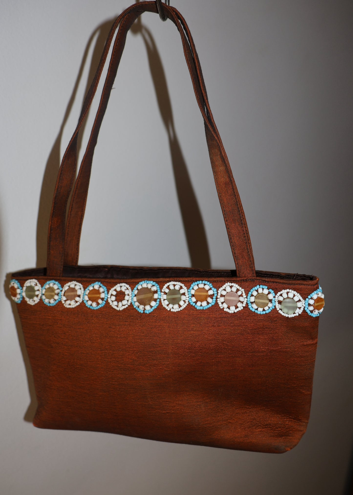 Bag with beaded detailing