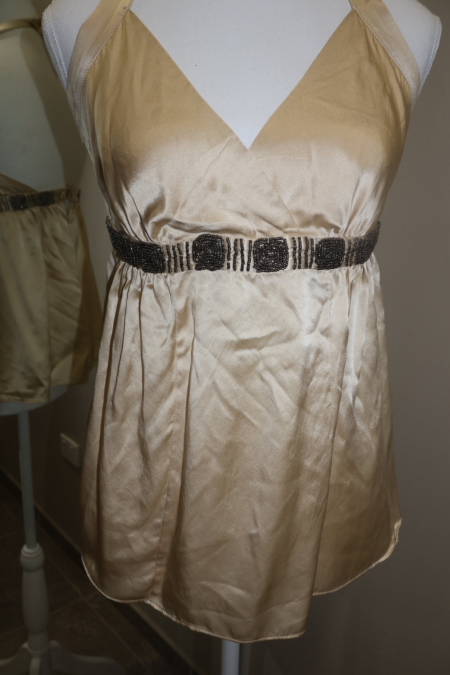 Cream halter neck top with beaded detail!