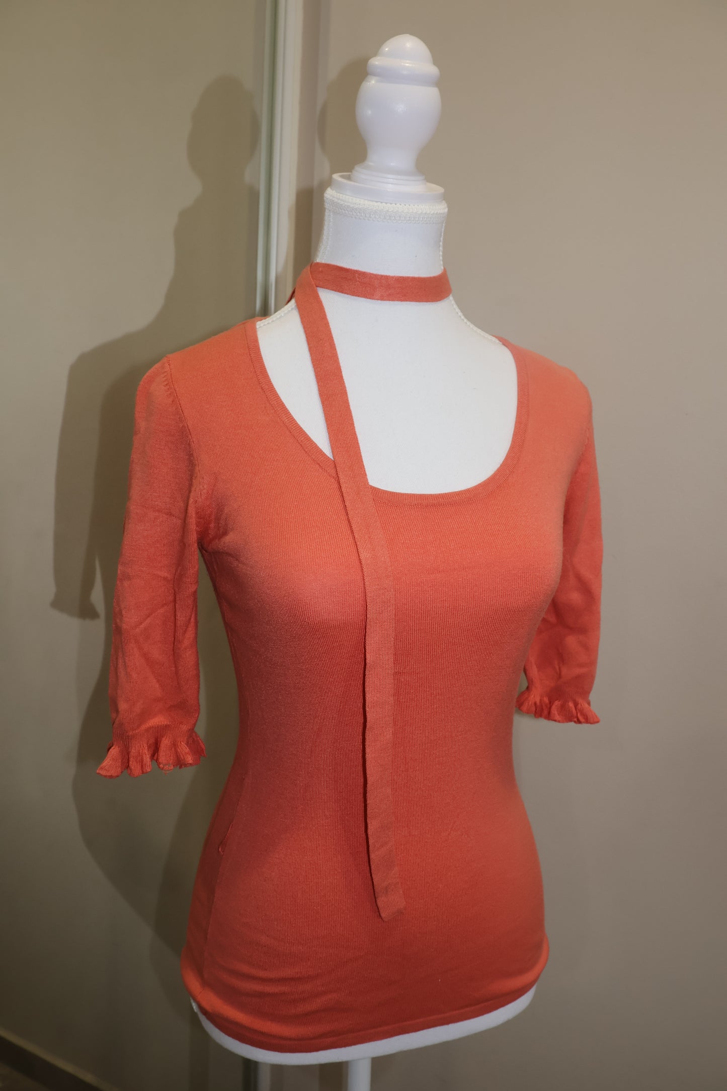 Orange short sleeve top with detached tie detail