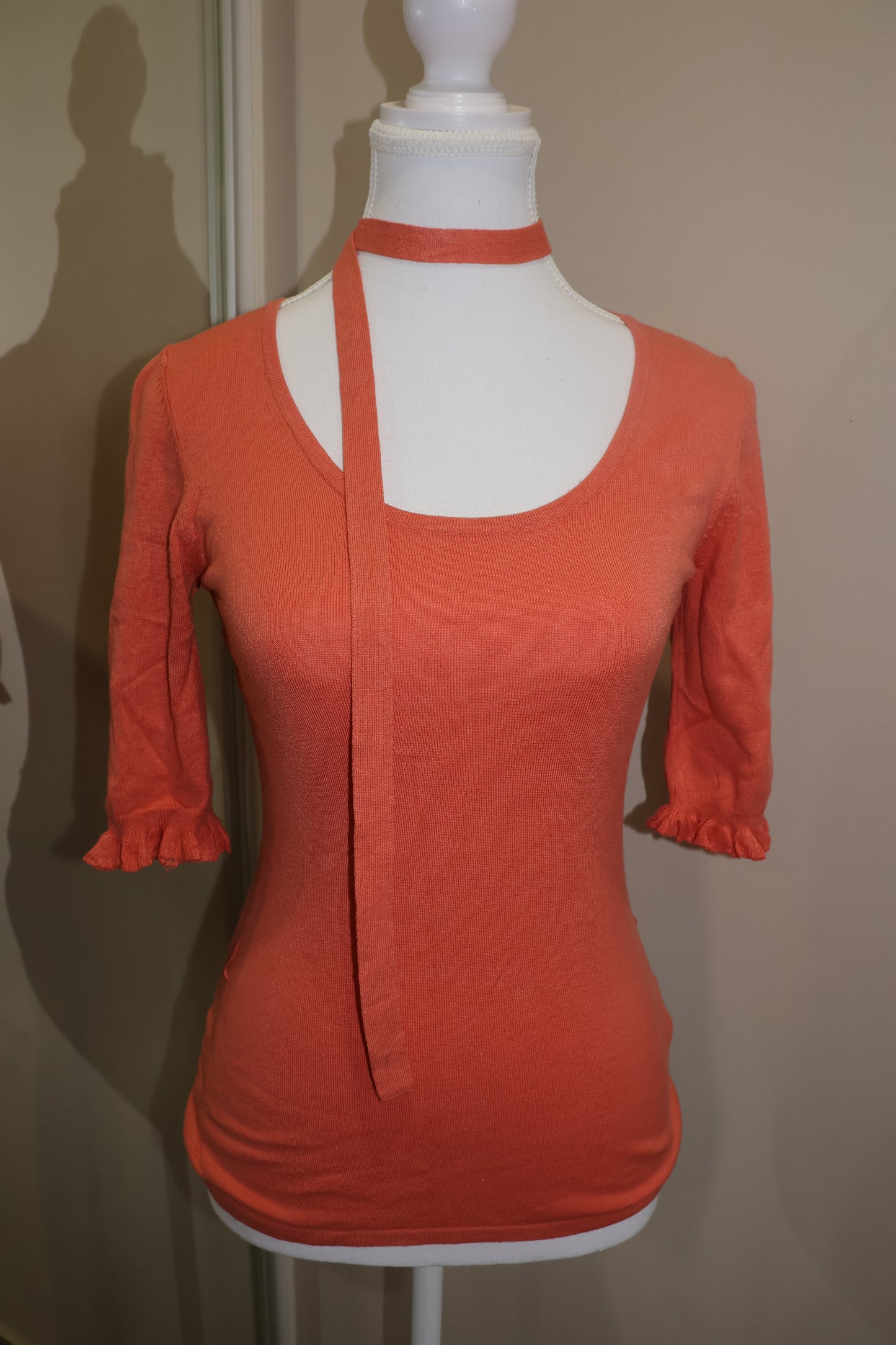 Orange short sleeve top with detached tie detail